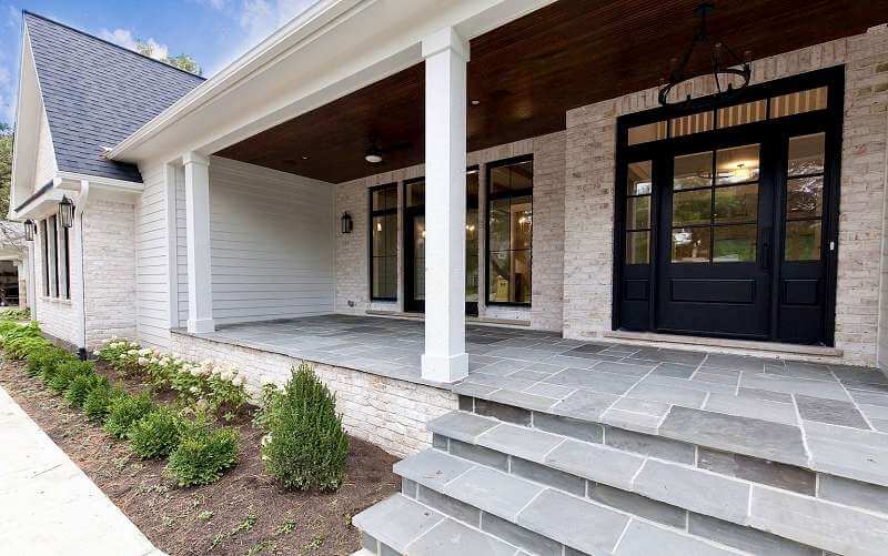 Exterior White Siding and Brick with Black Doors and Windows in 2936 Black Emerald by Sherwin Williams