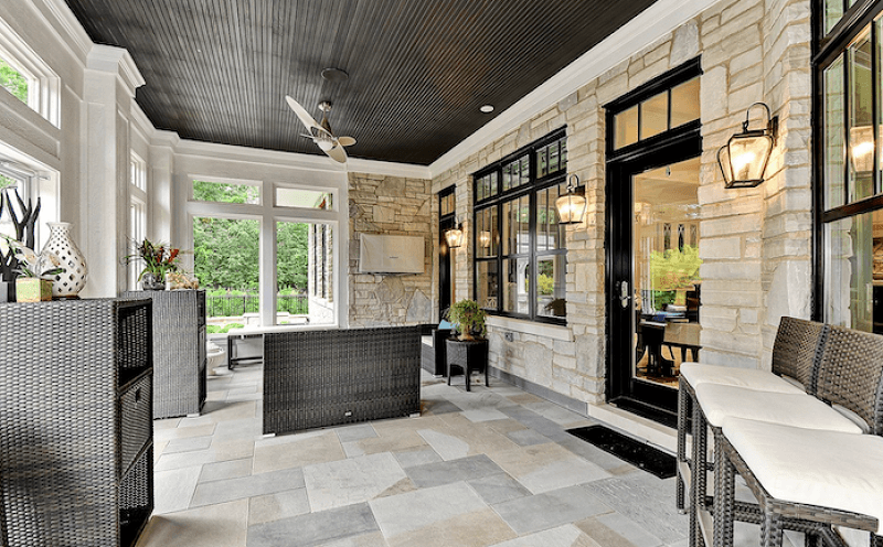 Striking Sun Room with Ceiling Stained in Bohemian Black and Painted Black Gloss Trim in Sherwin Williams 6993 Black of Night